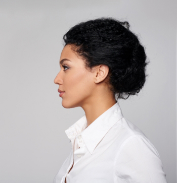 profile of woman in white shirt 