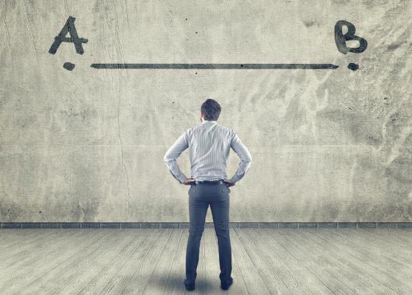 man looking at pathway on wall