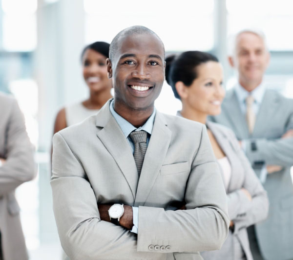 man in suit with arms folded