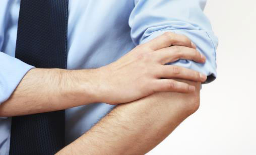 man rolling up sleeve
