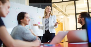 woman presenting to a group 