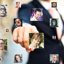 man pointing to images of other people