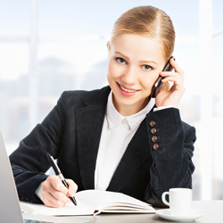 woman on phone writing