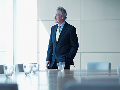 Man looking out office Window