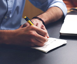 image of hands writing 